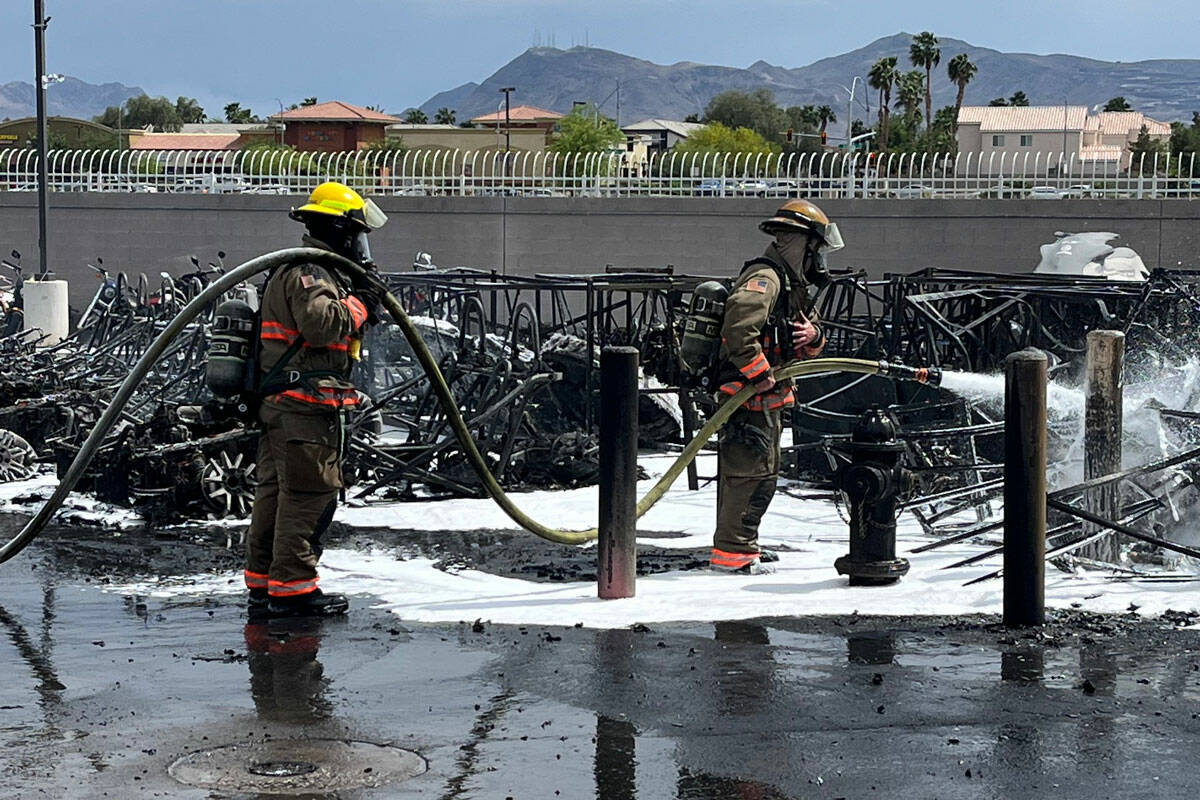 Clark County Fire Department crews work to extinguish a fire at RideNow Powersports near the co ...