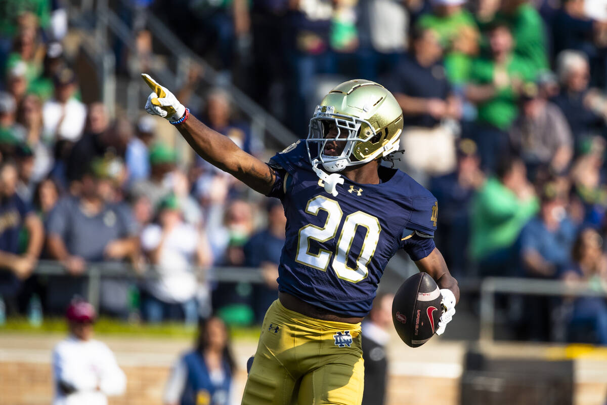 Notre Dame defensive back Benjamin Morrison (20) celebrates an interception that was called bac ...