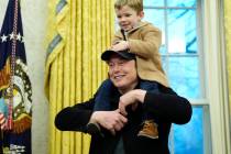 Elon Musk, joined by his son X Æ A-Xii, speaks in the Oval Office at the White House, Tues ...