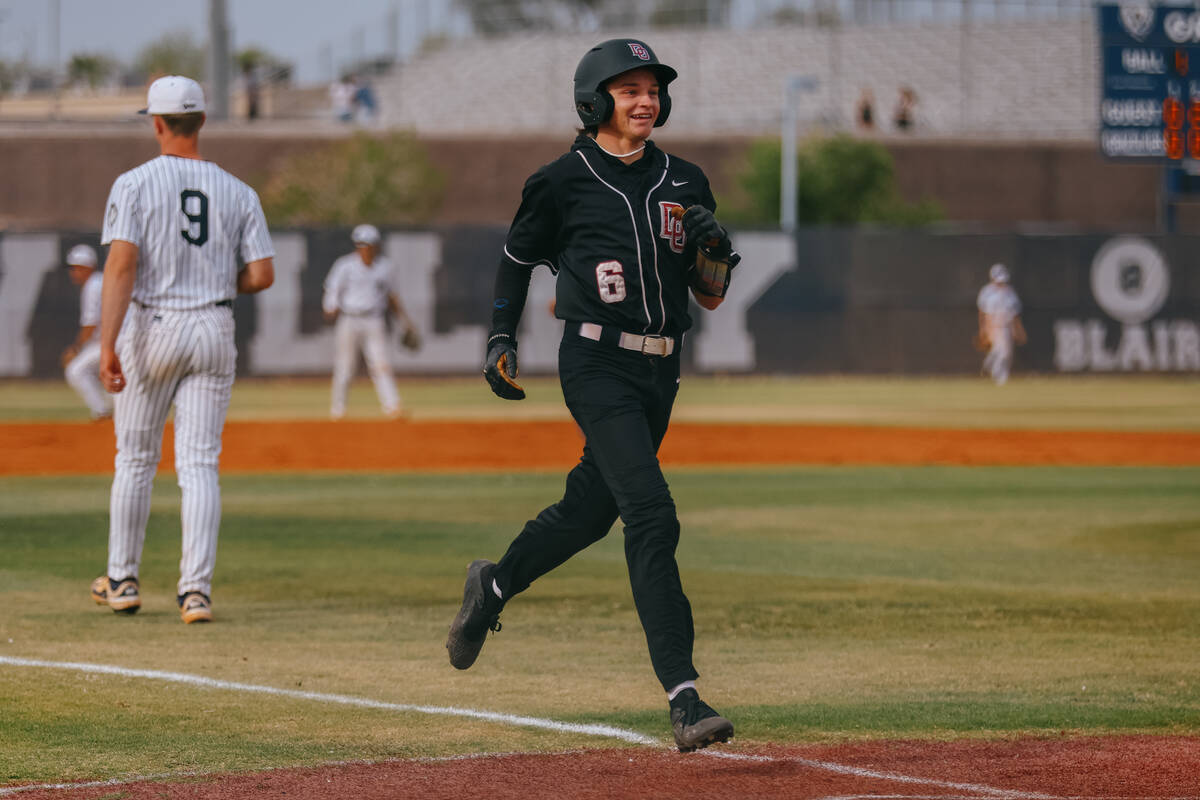 Desert Oasis’ Max Kieffer (6) makes it safely to home plate during the baseball game aga ...