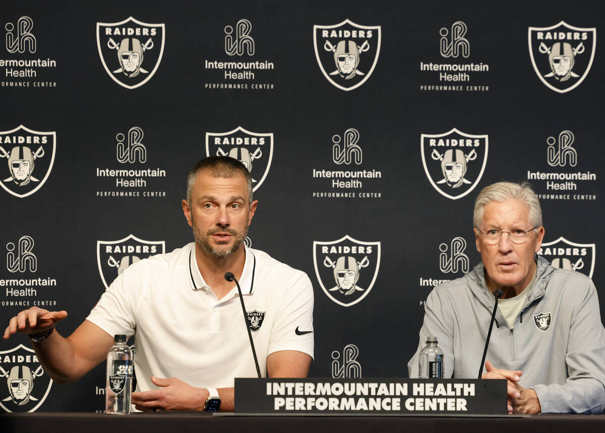 Raiders head coach Pete Carroll, right, listens as General Manager John Spytek speaks during th ...