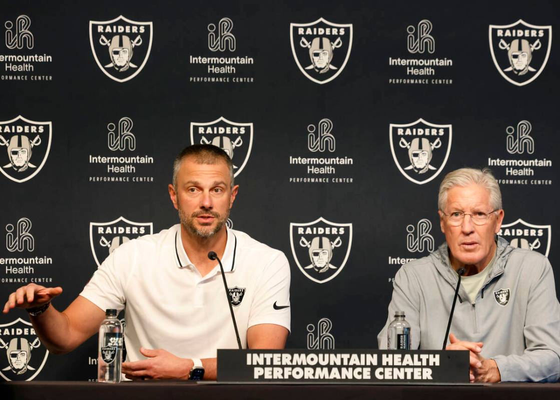 Raiders head coach Pete Carroll, right, listens as General Manager John Spytek speaks during th ...