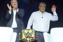 Steve Hill, left, president and CEO of the Las Vegas Convention and Visitors Authority, and WWE ...