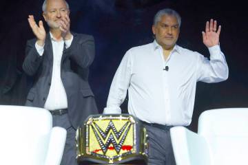 Steve Hill, left, president and CEO of the Las Vegas Convention and Visitors Authority, and WWE ...