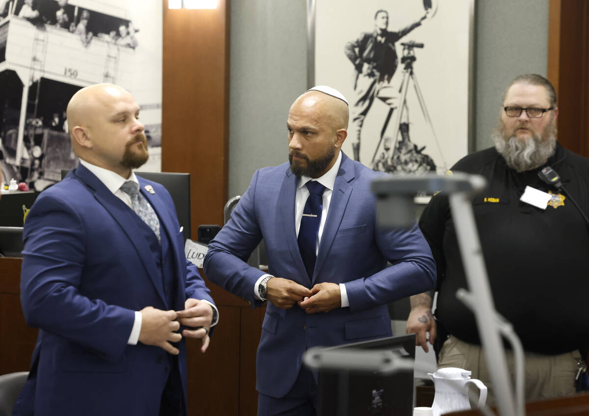 Metropolitan Police Department Sgt. Kevin Menon, center, accused of misconduct and possession o ...