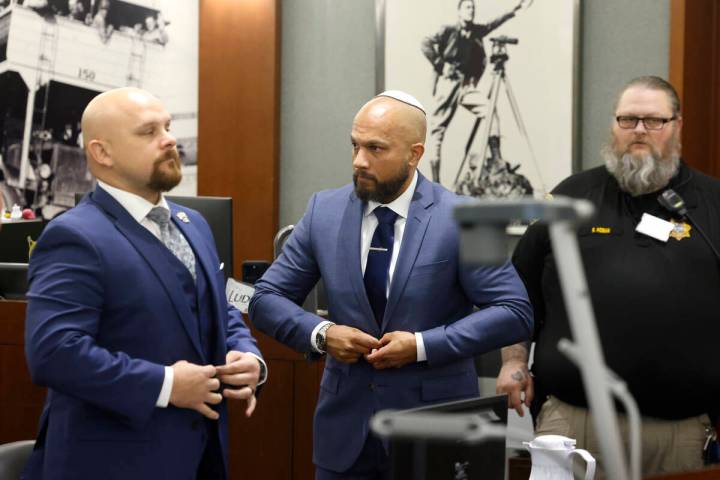 Metropolitan Police Department Sgt. Kevin Menon, center, accused of misconduct and possession o ...