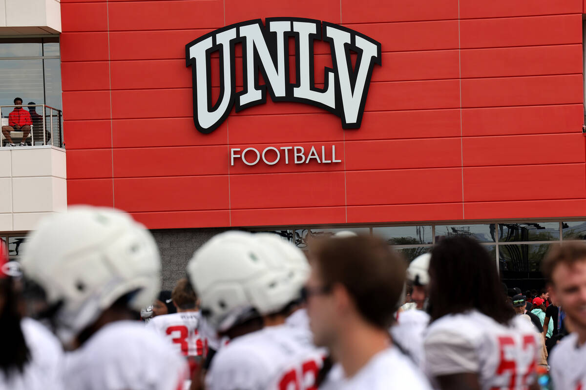 UNLV football players watch a team scrimmage from the sidelines at Bill 'Wildcat' Morris Rebel ...