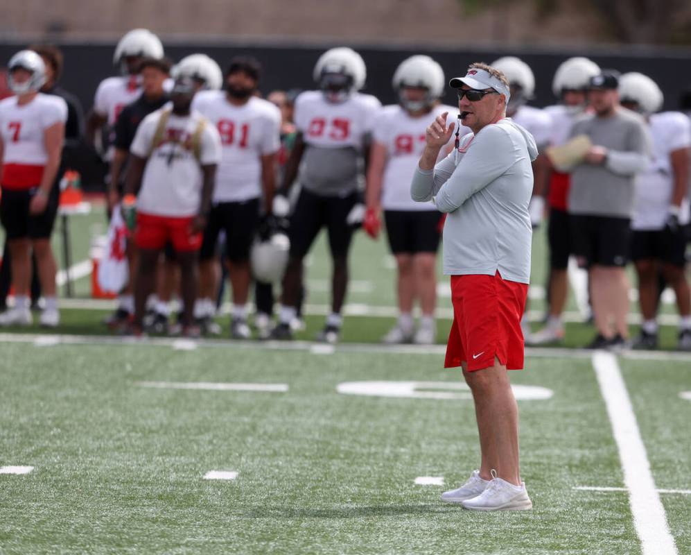 UNLV coach Dan Mullen watches his team scrimmage at Bill 'Wildcat' Morris Rebel Park in Las Veg ...