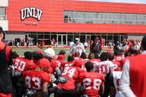 UNLV coach Dan Mullen talks to his team after a scrimmage at Bill 'Wildcat' Morris Rebel Park i ...