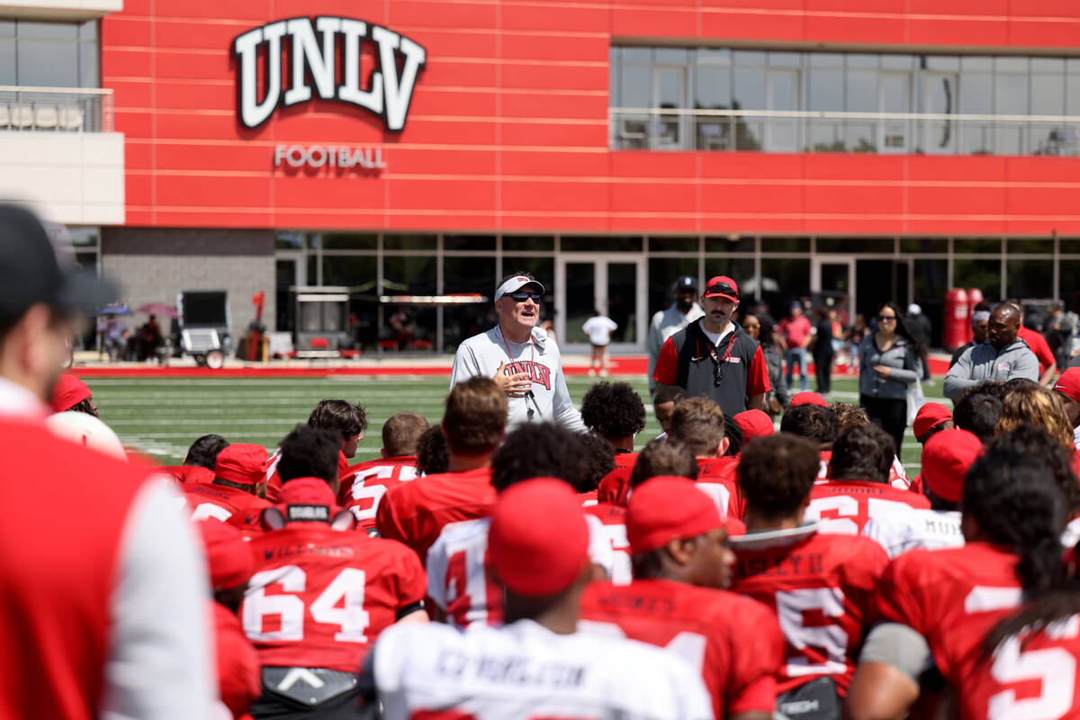 UNLV coach Dan Mullen talks to his team after a scrimmage at Bill 'Wildcat' Morris Rebel Park i ...