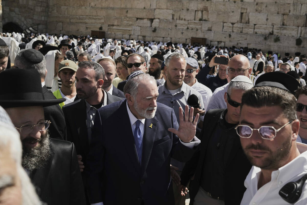 US ambassador to Israel Mike Huckabee, center, visits the Western Wall, the holiest site where ...