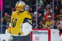 Golden Knights goaltender Adin Hill (33) tosses the puck after making a save during an NHL hock ...