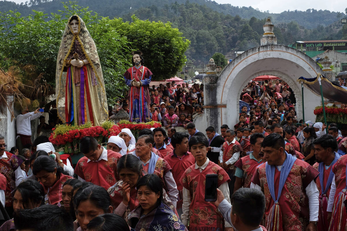 Tzotziles Indigenous people take part in a Holy Week procession at San Lorenzo Martir Church in ...