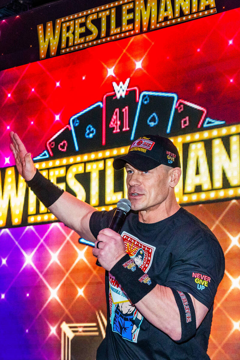 Champion wrestler John Cena visits with fans during a WrestleMania kickoff party hosted by expe ...
