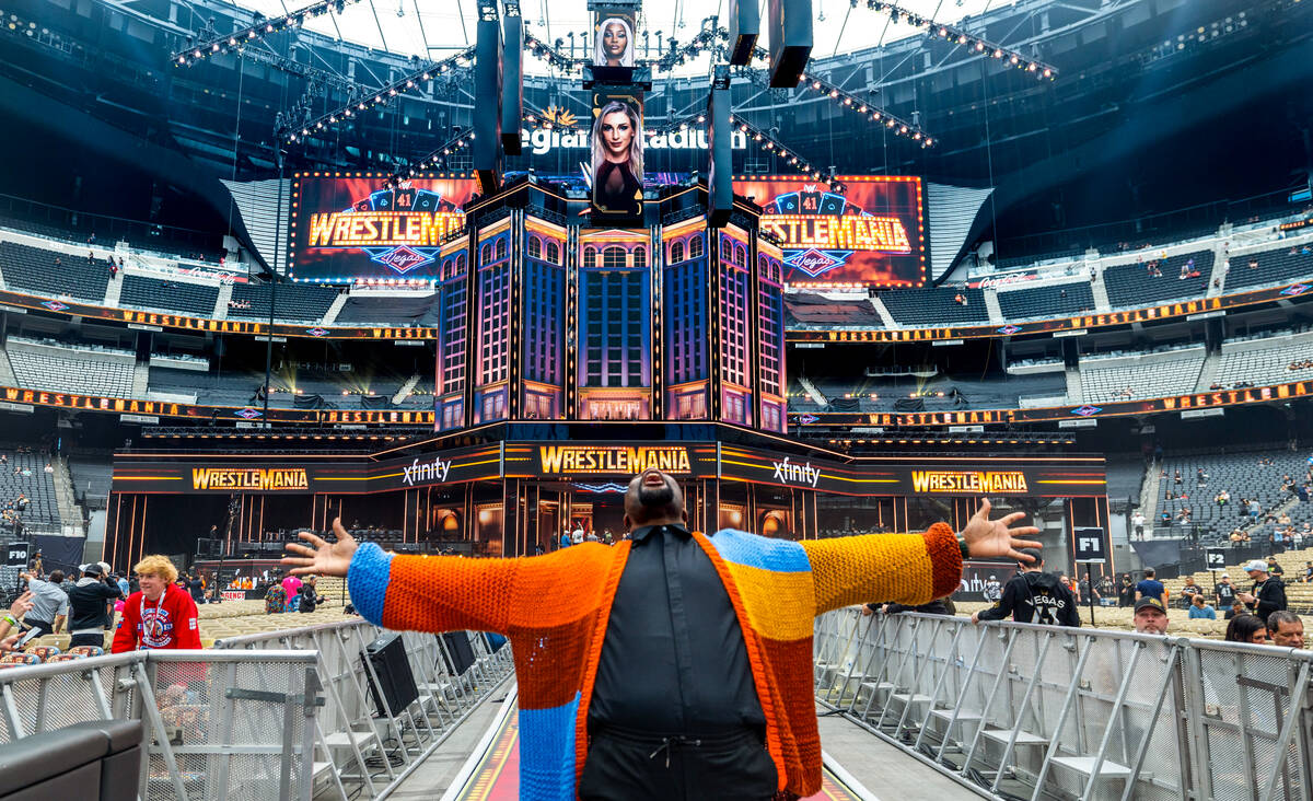 Fan Alfred Konuwa of Los Angeles gets a look at the wrestling floor during a WrestleMania kicko ...