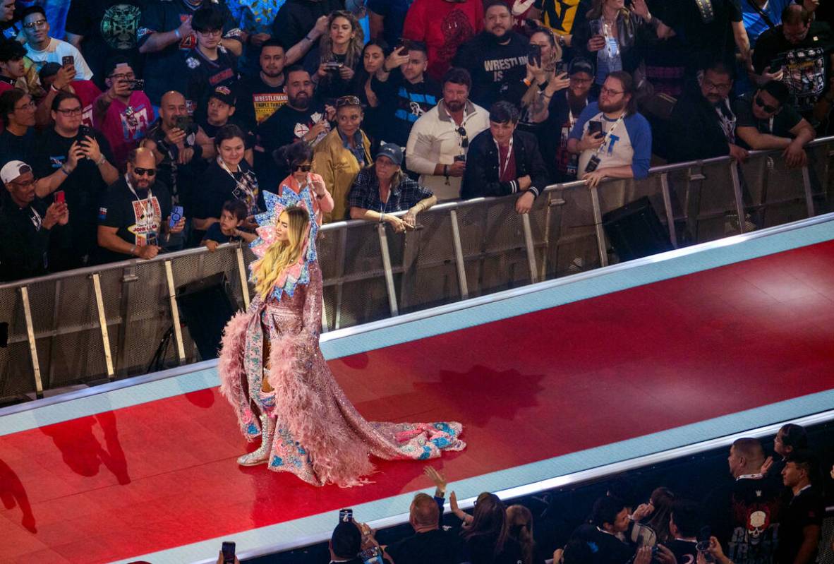 Charlotte Flair arrives on the walkway in a gown to face Tiffany Stratton during their WWE Wome ...