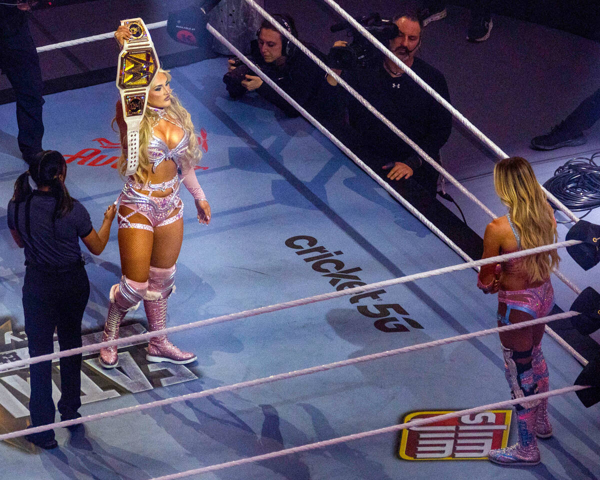Tiffany Stratton taunts Charlotte Flair with her title belt during their WWE Women's Championsh ...
