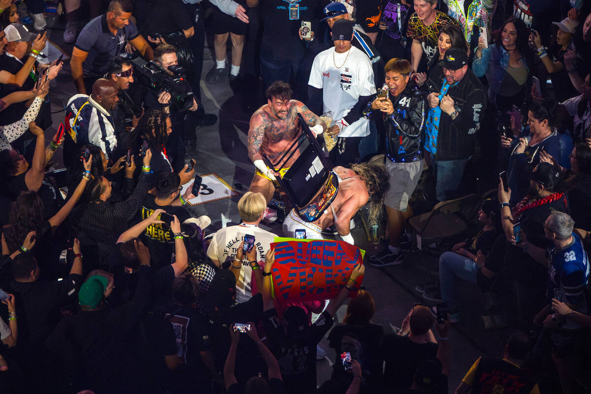 Fans are right in the thick of the action away from the ring as CM Punk smashes a chair onto Se ...