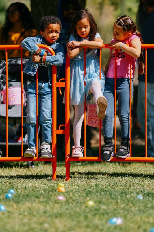From left, Kai Jackson, Eliza Carratelli and Parker Blancas, all 5, hang out on the railing of ...