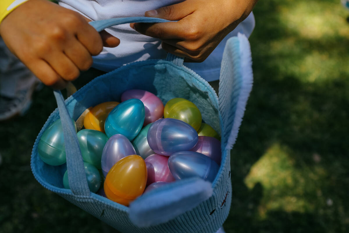 Mateo Perez, 7, shows off the cache of eggs he collected during the annual community egg hunt h ...