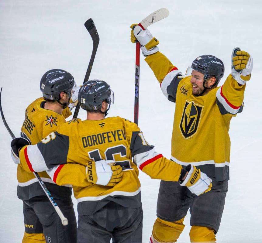 The Golden Knights celebrate a score against the Minnesota Wild during the first period of game ...