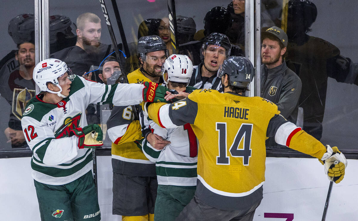 Golden Knights right wing Mark Stone (61) wants to mix it up with Minnesota Wild center Joel Er ...