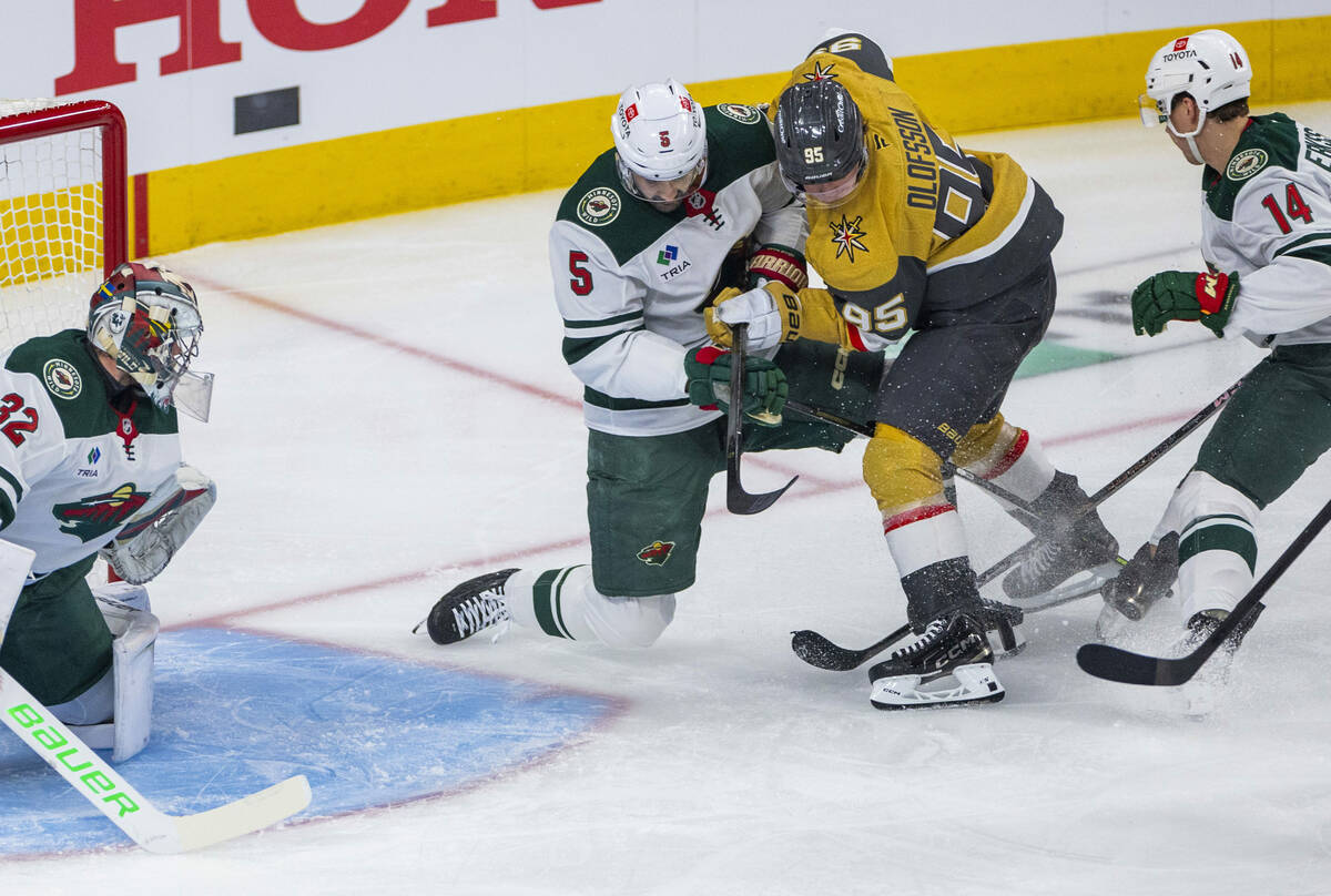 Golden Knights right wing Victor Olofsson (95) has the puck at his skate as he looks to score a ...