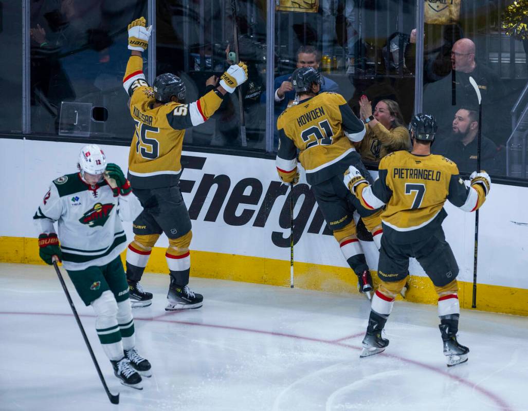 Golden Knights center Brett Howden (21) celebrates his score with right wing Keegan Kolesar (5 ...