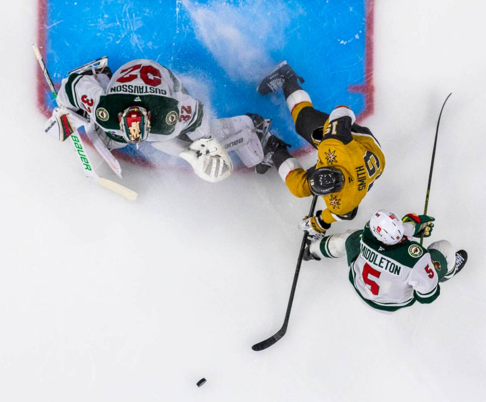 Minnesota Wild goaltender Filip Gustavsson (32) looks to defend the net from Golden Knights rig ...