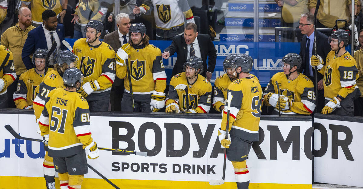 Golden Knights head coach Bruce Cassidy has instructions for his players during a timeout again ...