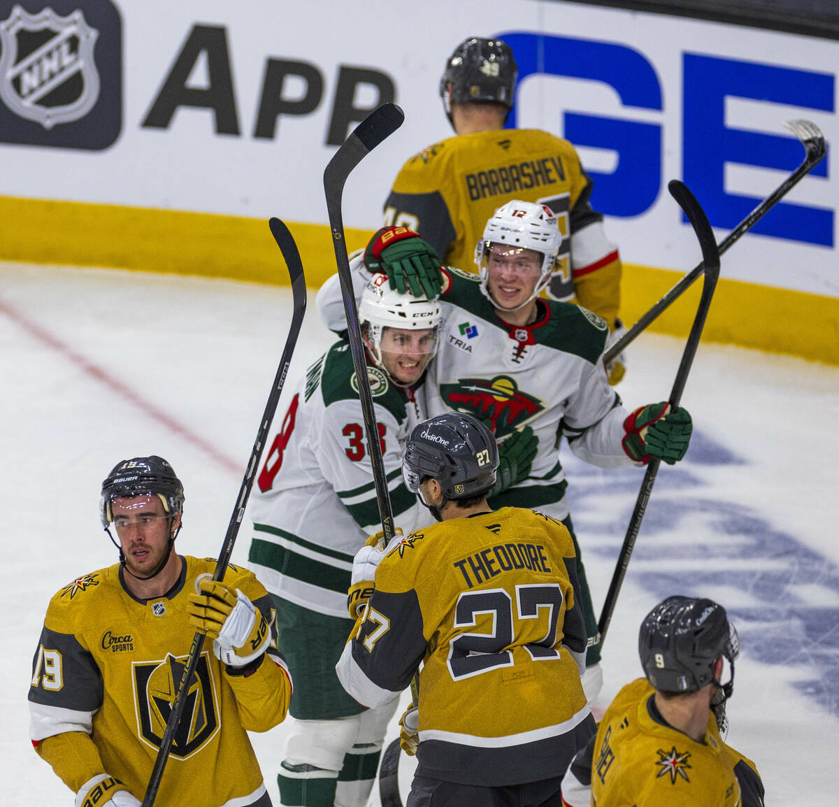 Minnesota Wild right wing Ryan Hartman (38) and left wing Matt Boldy (12) celebrate their goal ...