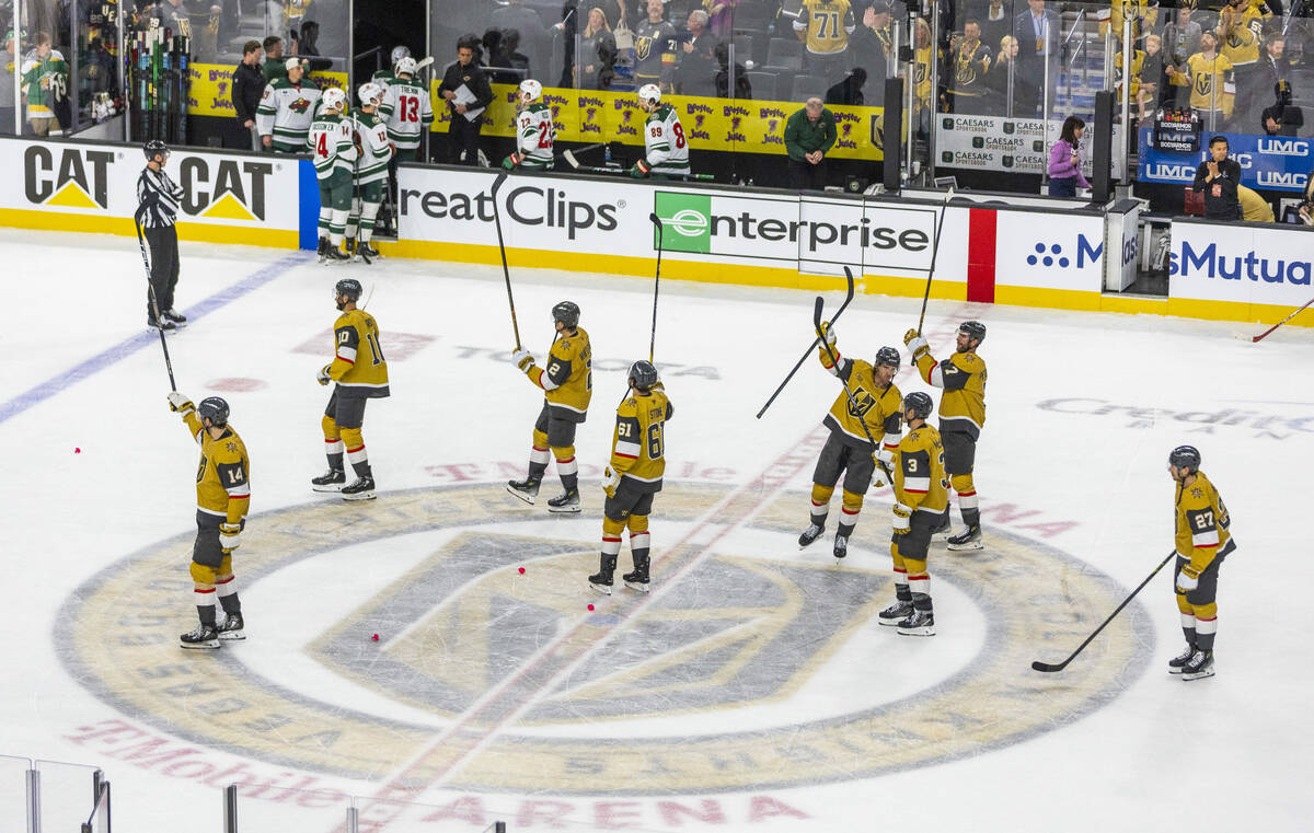 Golden Knights players celebrate the fans after defeating the Minnesota Wild during game one in ...
