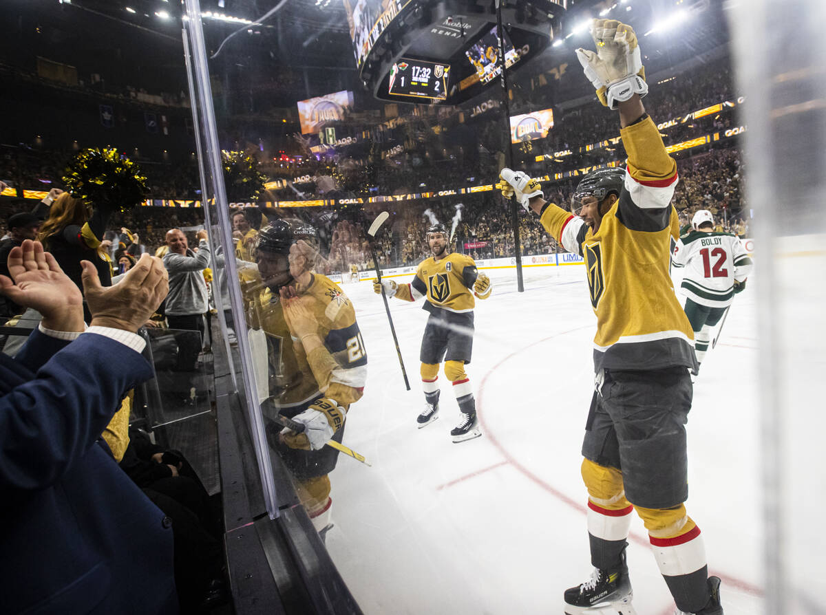 Golden Knights center Brett Howden, center left, celebrates his goal against the Minnesota Wild ...