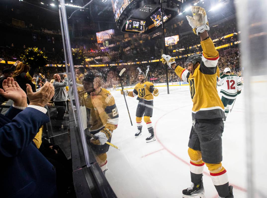 Golden Knights center Brett Howden, center left, celebrates his goal against the Minnesota Wild ...