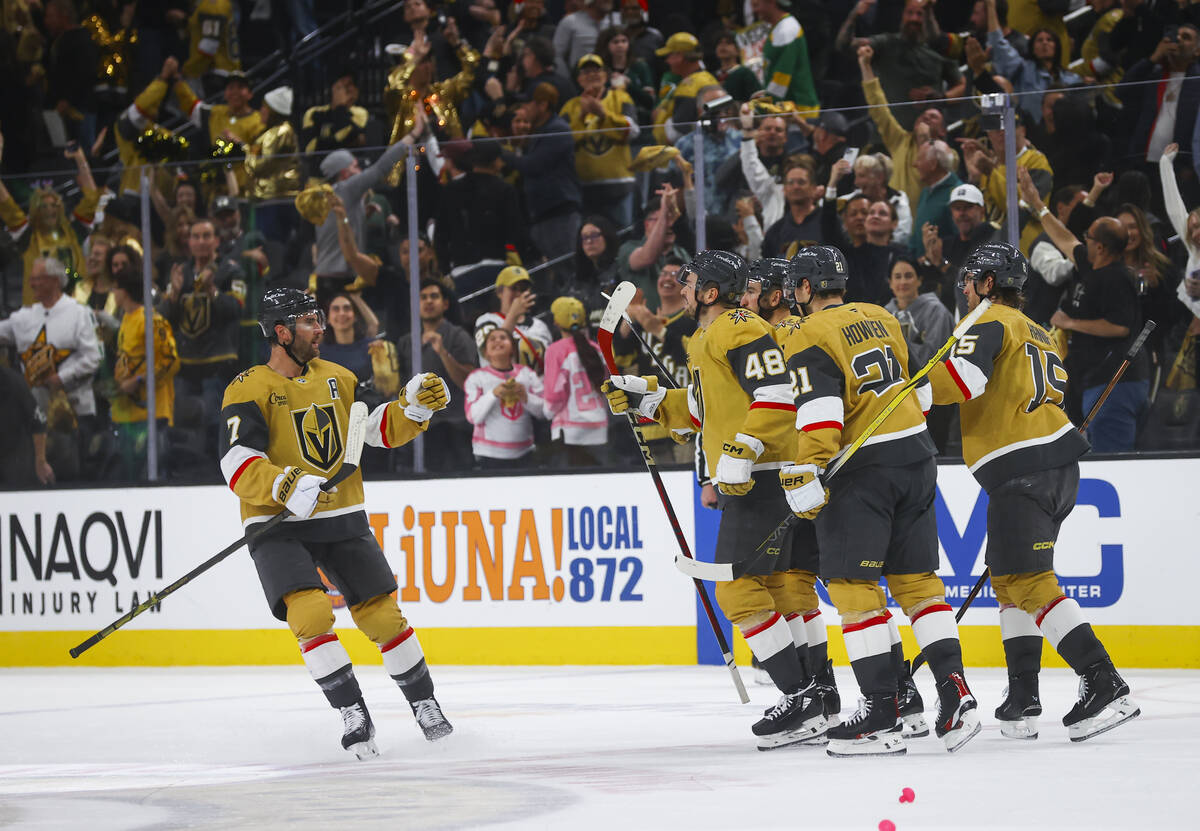 The Golden Knights celebrate their victory over the Minnesota Wild in a first-round NHL hockey ...