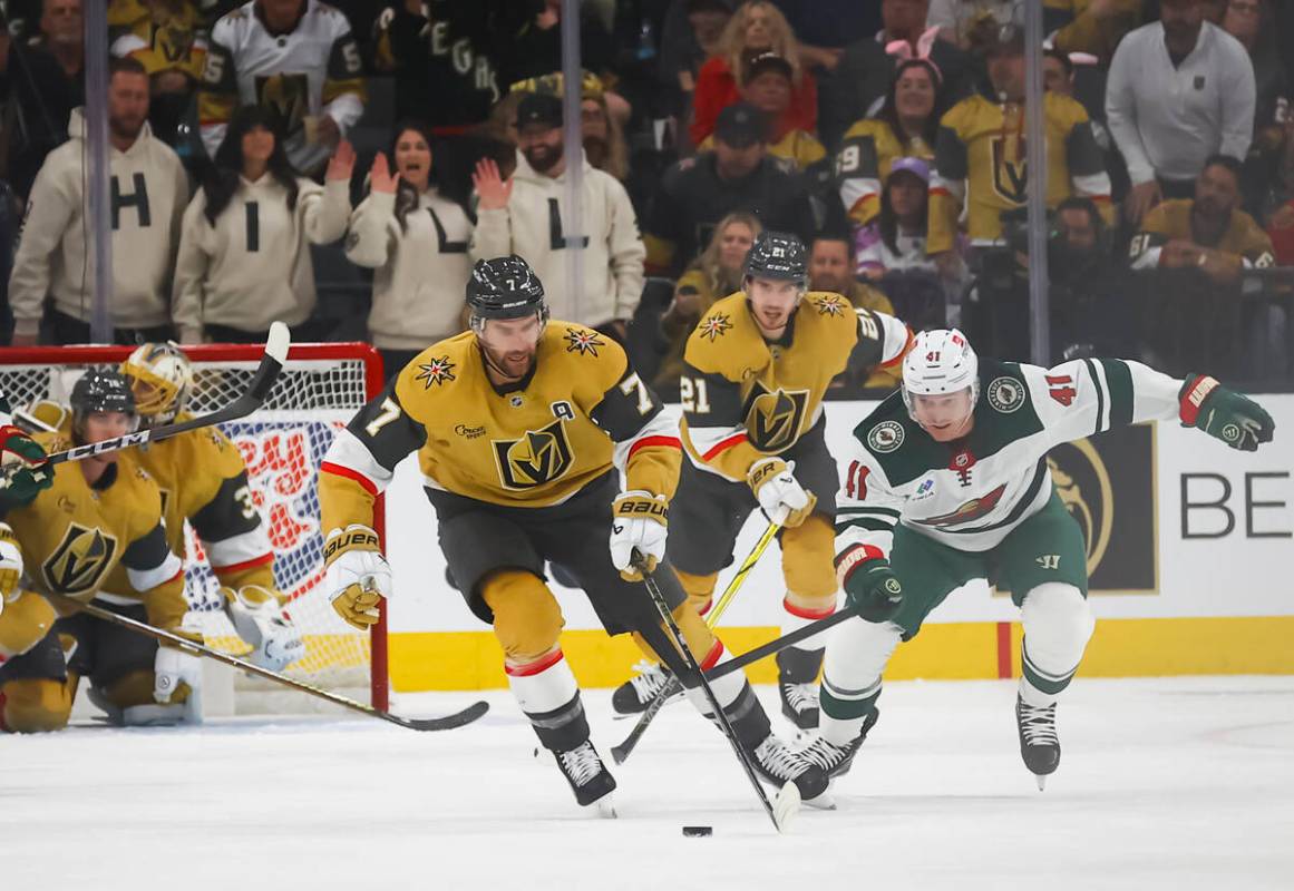 Golden Knights defenseman Alex Pietrangelo (7) skates with the puck ahead of Minnesota Wild cen ...