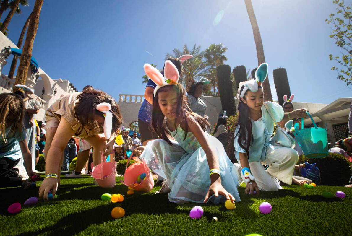 Jennifer, 7, of Las Vegas, grabs easter eggs during an Easter celebration for members of the Do ...