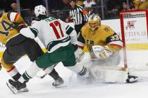 Golden Knights goaltender Adin Hill (33) defends the net during the second period of their firs ...