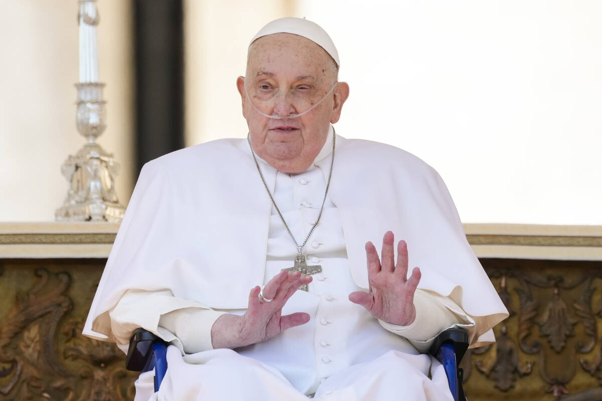 Pope Francis arrives in a wheelchair at the end of a mass in St. Peter's Square at The Vatican, ...