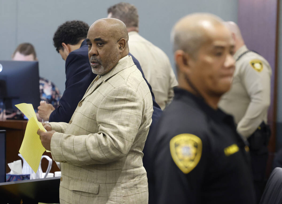 Duane Davis prepares to leave a courtroom during his battery trial at the Regional Justice Cent ...
