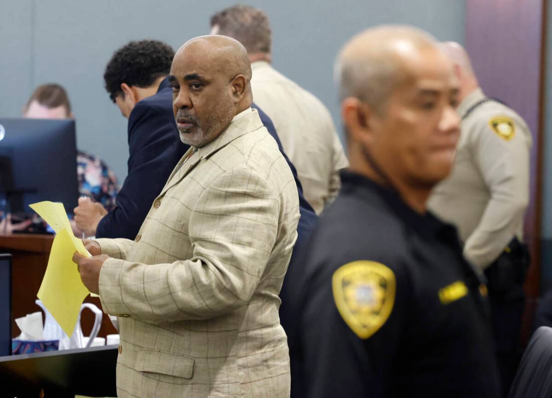 Duane Davis prepares to leave a courtroom during his battery trial at the Regional Justice Cent ...