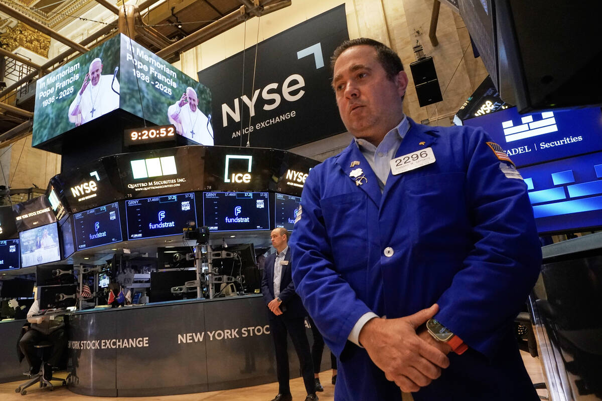 Specialist Gennaro Saporito joins others on the floor of the New York Stock Exchange to observe ...