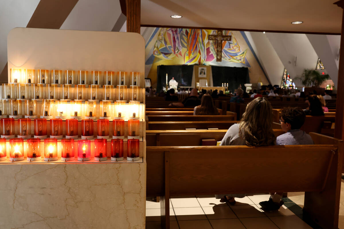 Worshipers attend mass at Guardian Angel Cathedral in Las Vegas Monday, April 21, 2025. (K.M. C ...