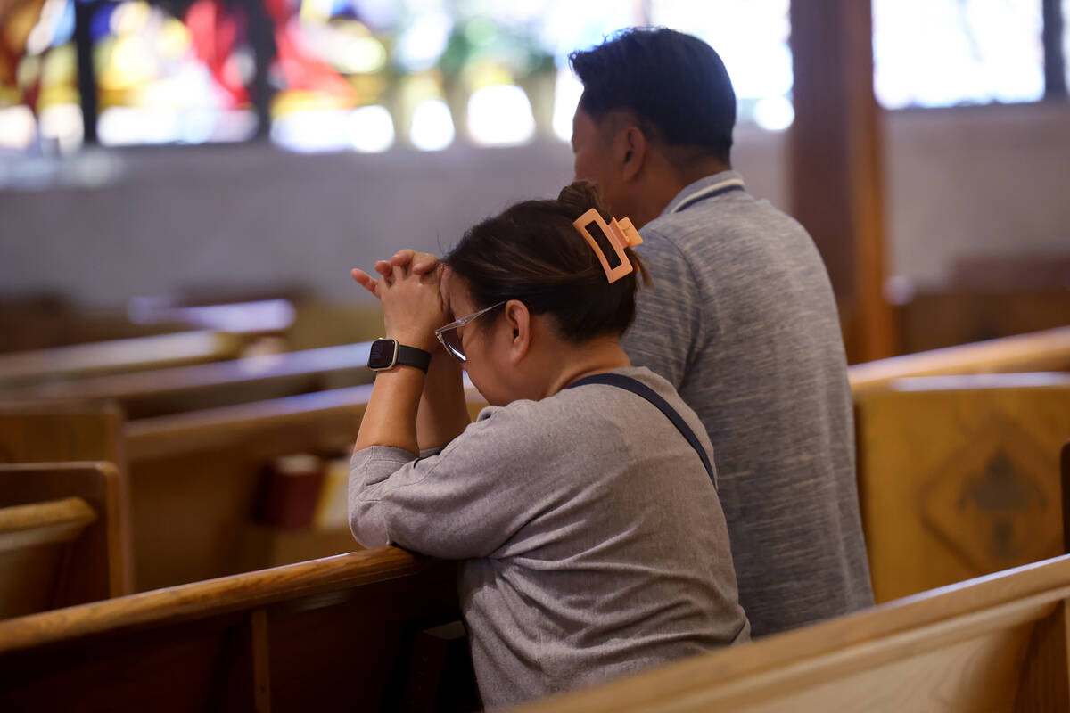 Worshipers Edna and Ernie Chua of Los Angeles attend mass at Guardian Angel Cathedral in Las Ve ...