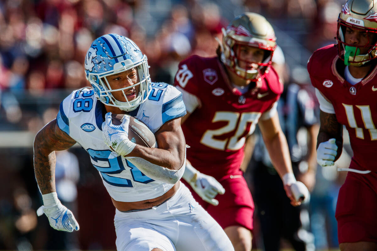 FILE - North Carolina running back Omarion Hampton (28) carries the ball during the first half ...