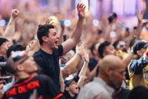 A fan cheers as Dominik Mysterio is declared a winner of an intercontinental championship match ...