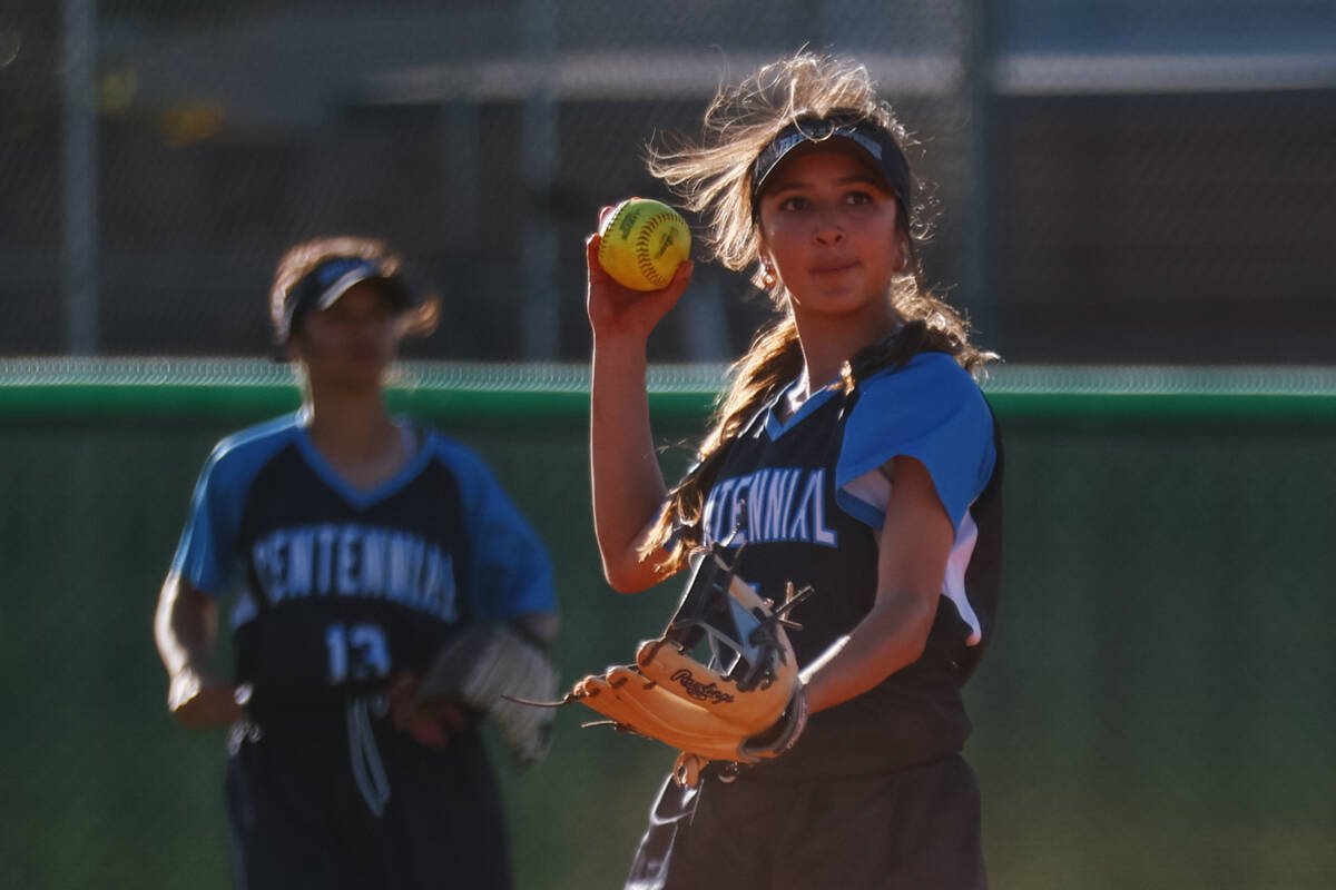 Centennial infielder Valeria Lopez (5) winds up to toss the ball to the pitcher during the soft ...
