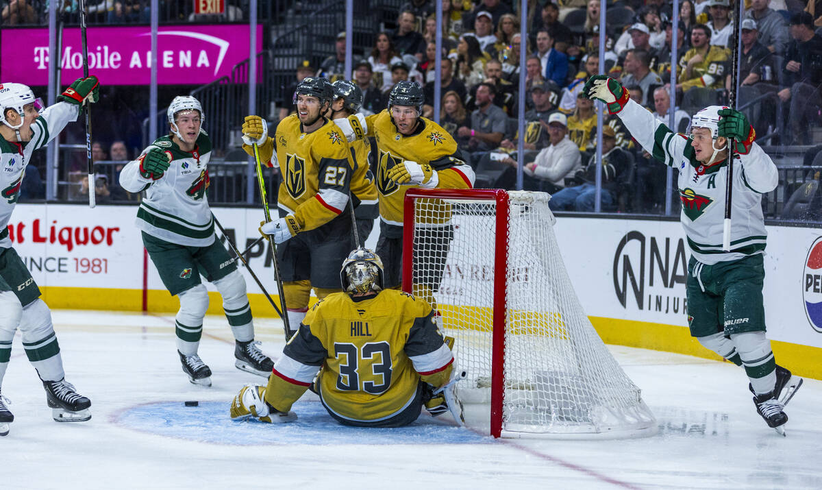Minnesota Wild players celebrate their fourth goal against Golden Knights goaltender Adin Hill ...