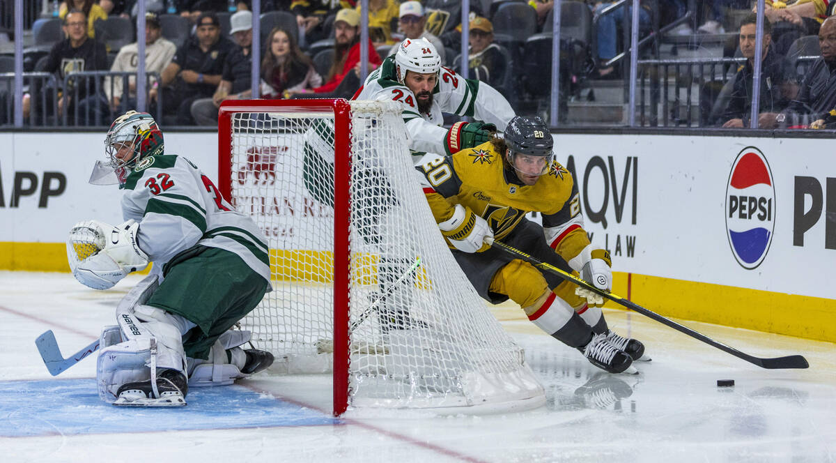 Golden Knights left wing Brandon Saad (20) works around the net for a pass with Minnesota Wild ...