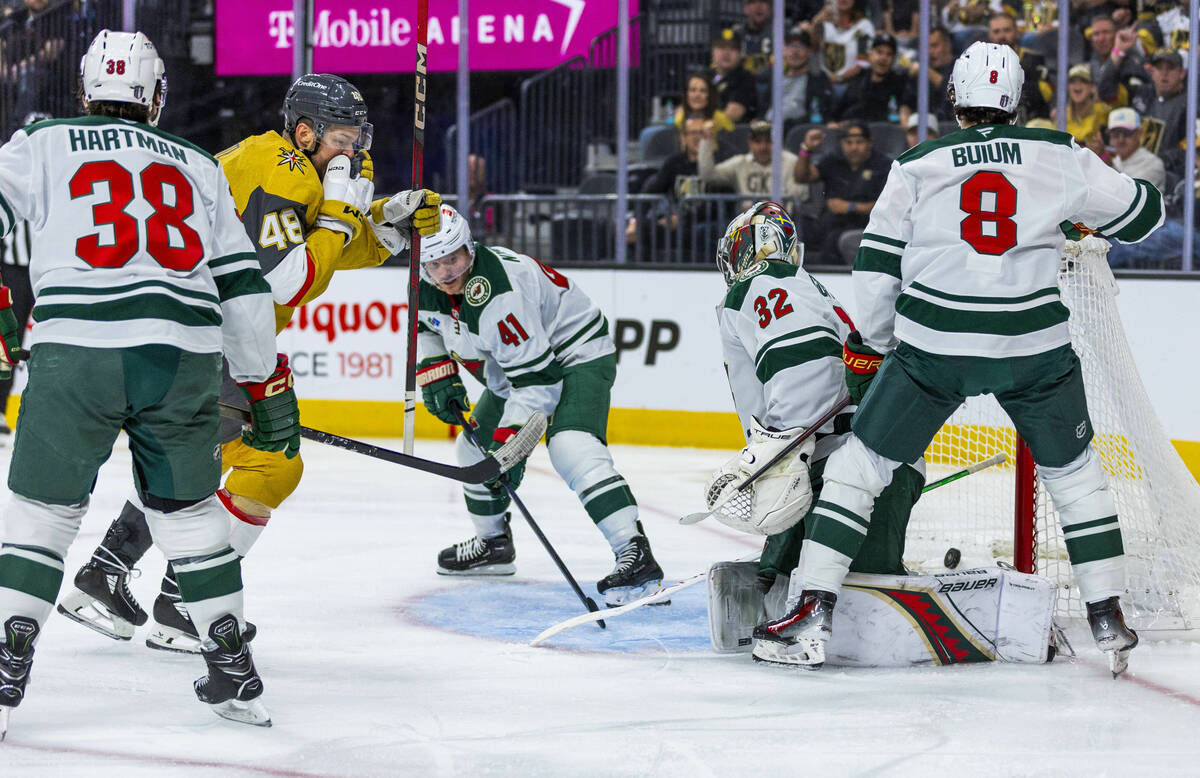 Golden Knights center Tomas Hertl (48) watches the puck slide past Minnesota Wild goaltender Fi ...
